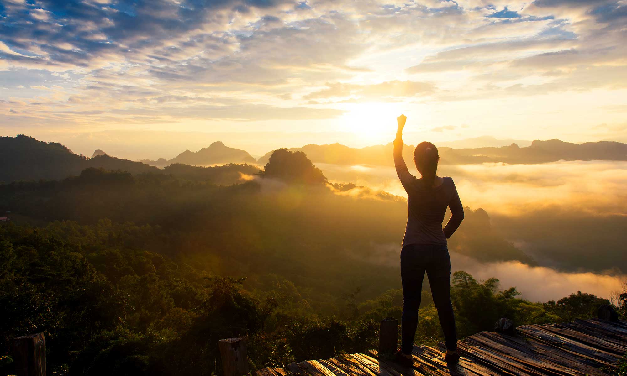 person with hand to the sky - achieve goals